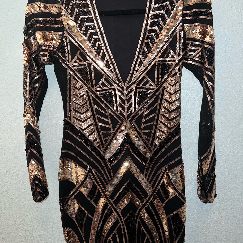 Express sequin dress. Black and gold. Size x-small. Plunging neckline.